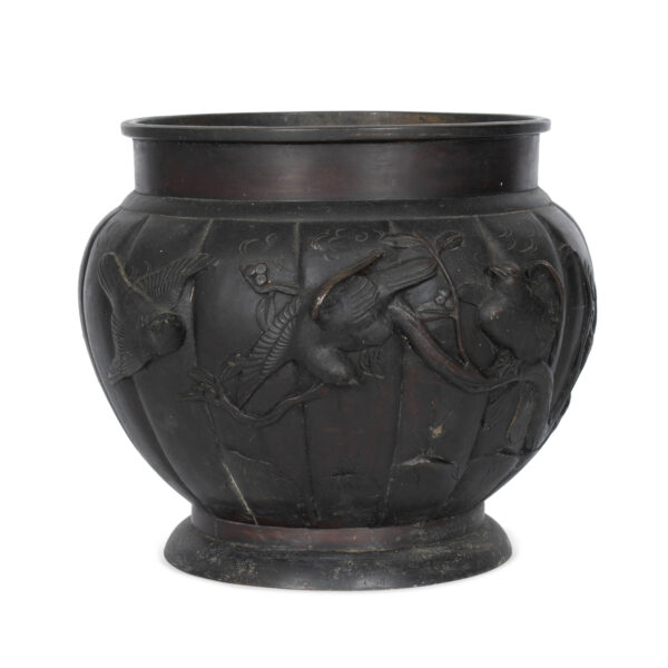 bronze planter with bird motif
