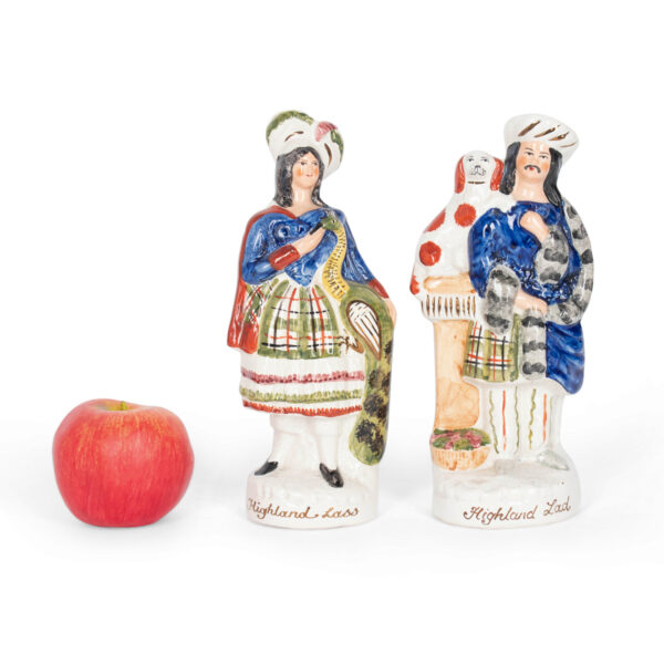 Pair of Staffordshire Highland Lad & Lass Porcelain Figures